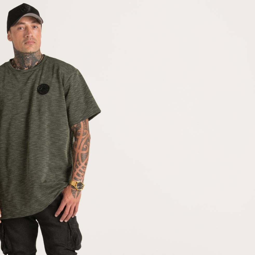 Green textured men's top with leather logo from Cravass clothing.