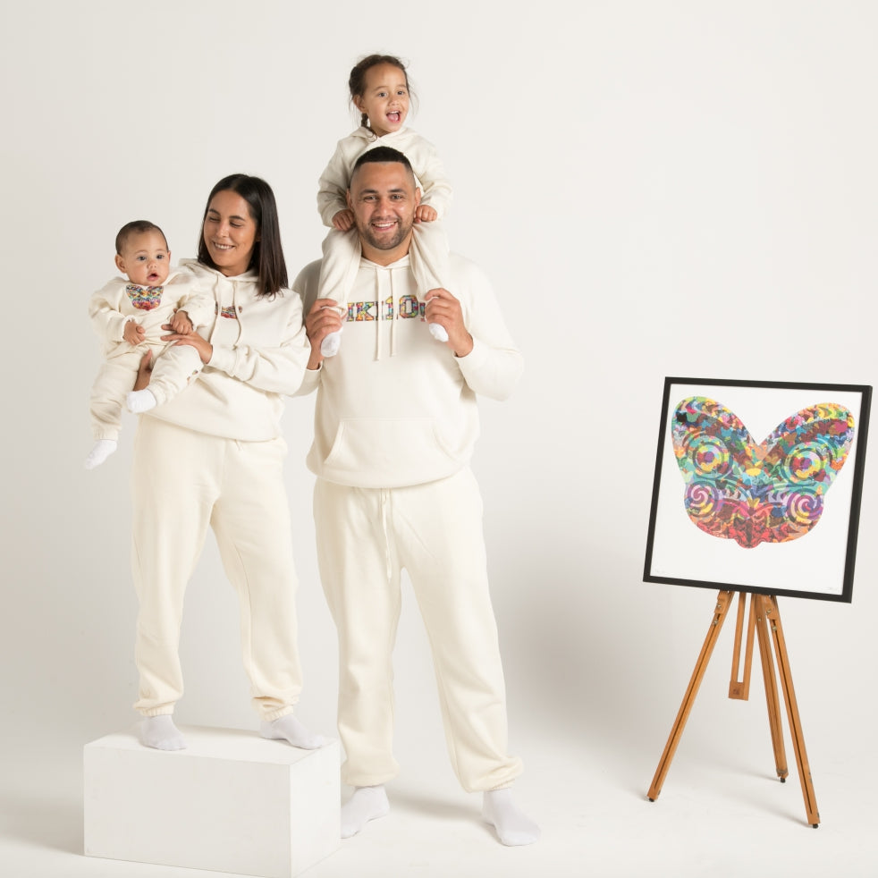 Whanau (family) wearing white hoodie track suit with Maori Tiki Design from Cravass Clothing.