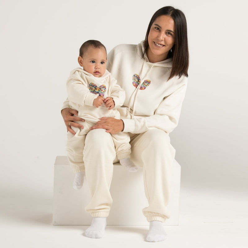 Whanau (family) wearing white hoodie track suit with Maori Tiki Design from Cravass Clothing.