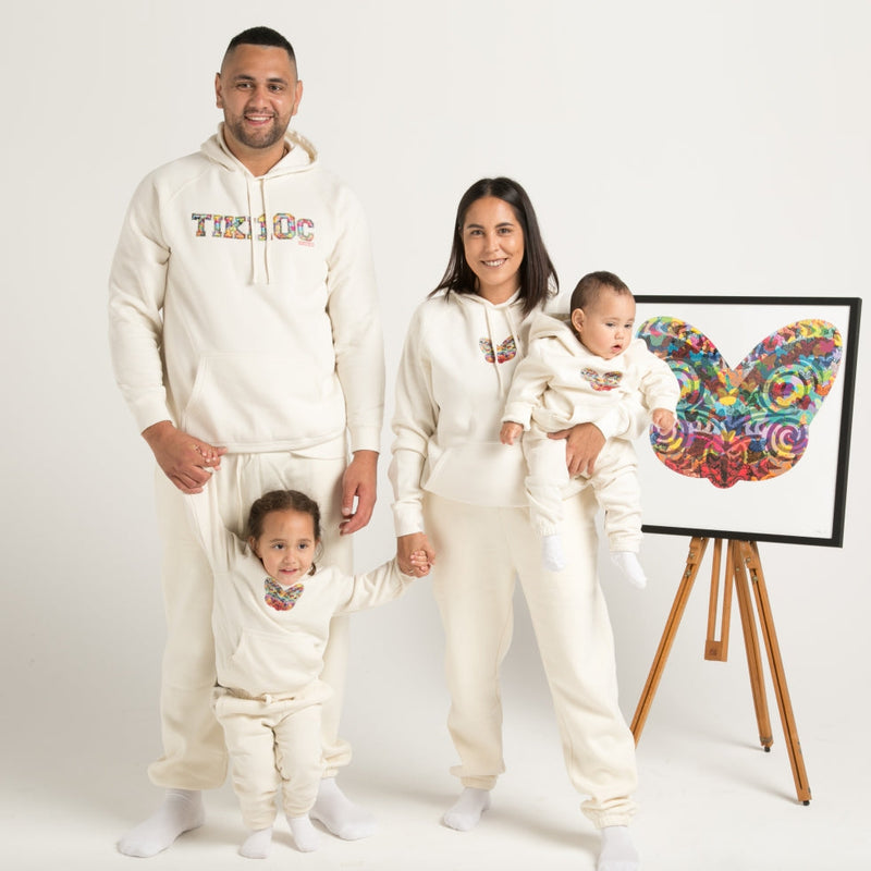 Whanau (family) wearing white hoodie track suit with Maori Tiki Design from Cravass Clothing.