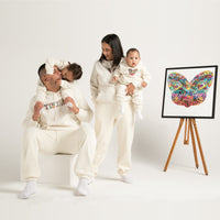 Whanau (family) wearing white hoodie track suit with Maori Tiki Design from Cravass Clothing.