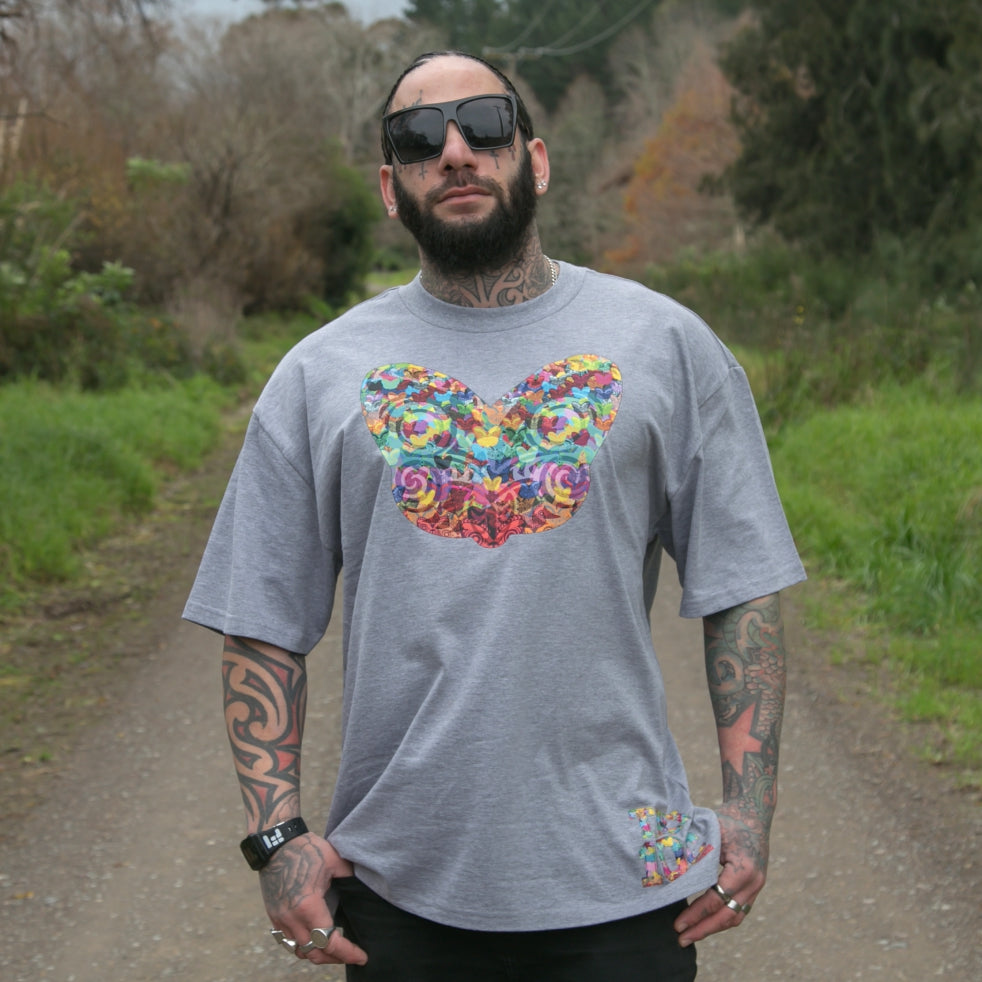 Men's grey heavyweight t-shirt with colourful Maori tiki design from Cravass clothing.