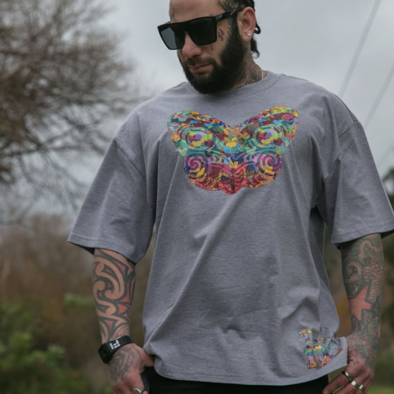 Men's grey heavyweight t-shirt with colourful Maori tiki design from Cravass clothing.